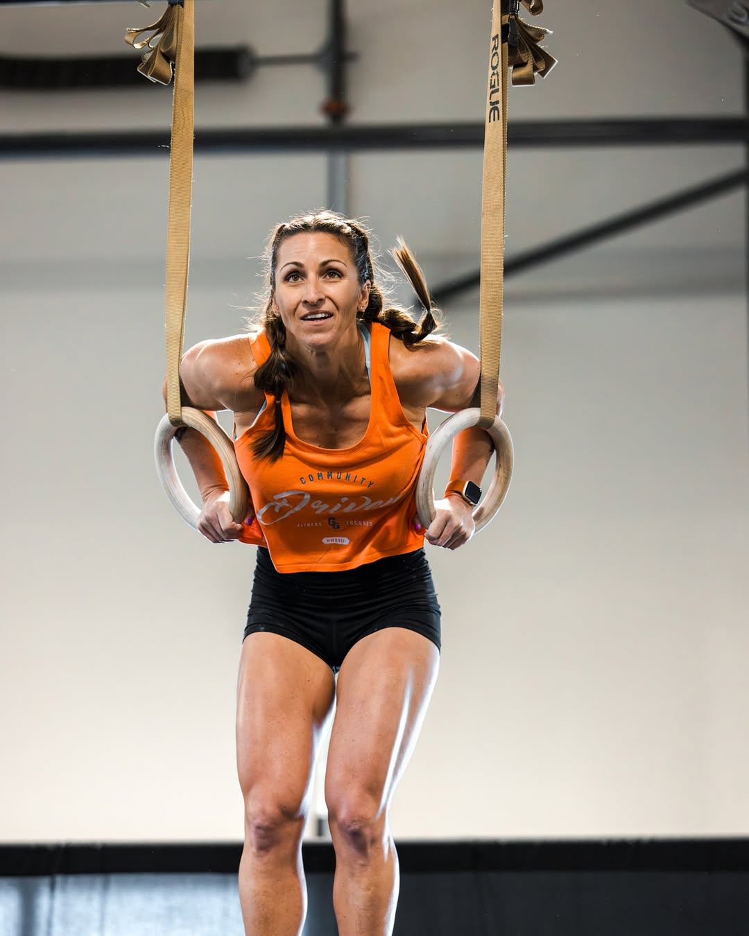 Athlete completing muscle-ups on rings