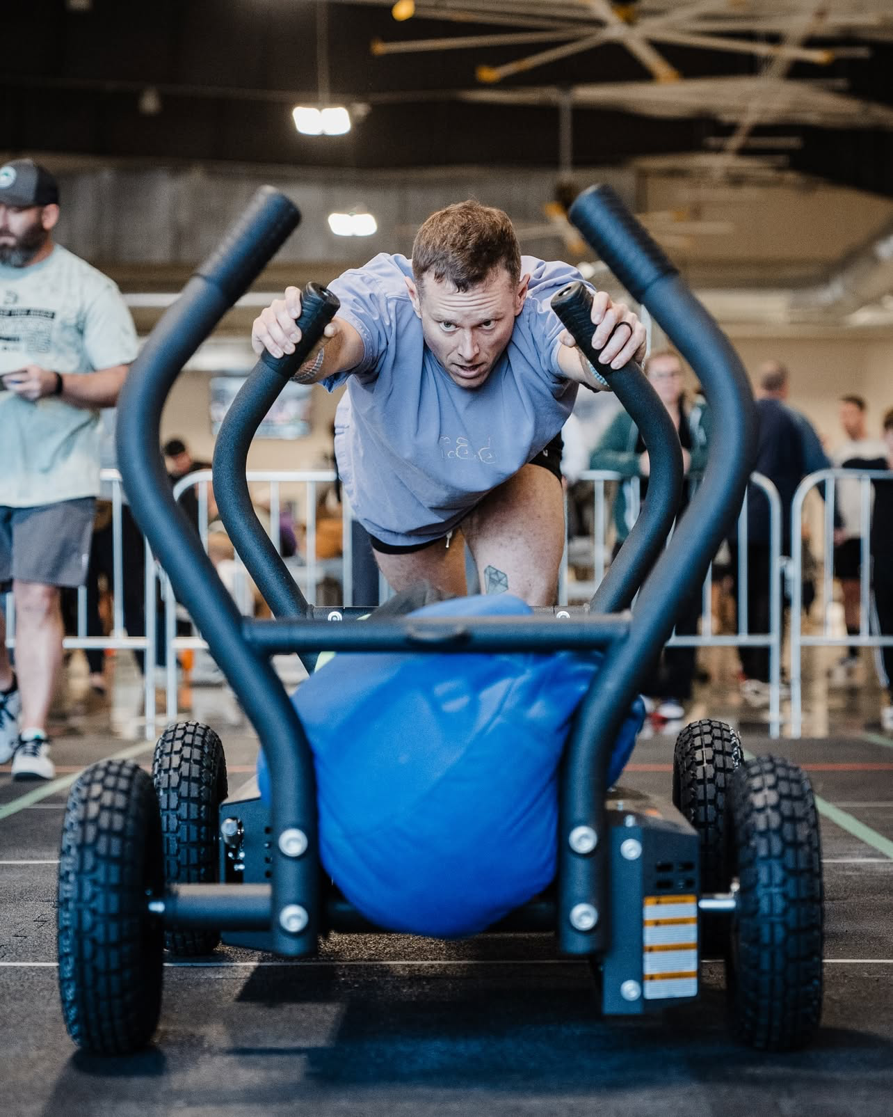 Athlete pushing a torque tank